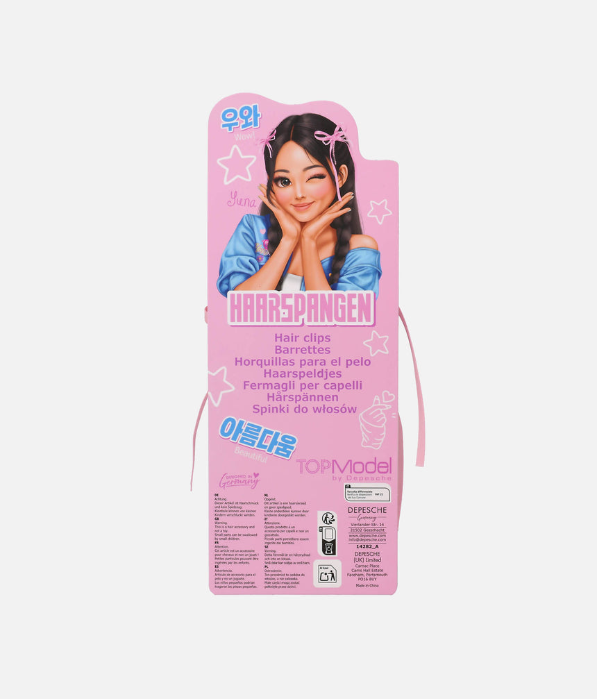 Back of the pink TOPModel KPOP bow hair clip card featuring Yena and the hair accessory safety warning