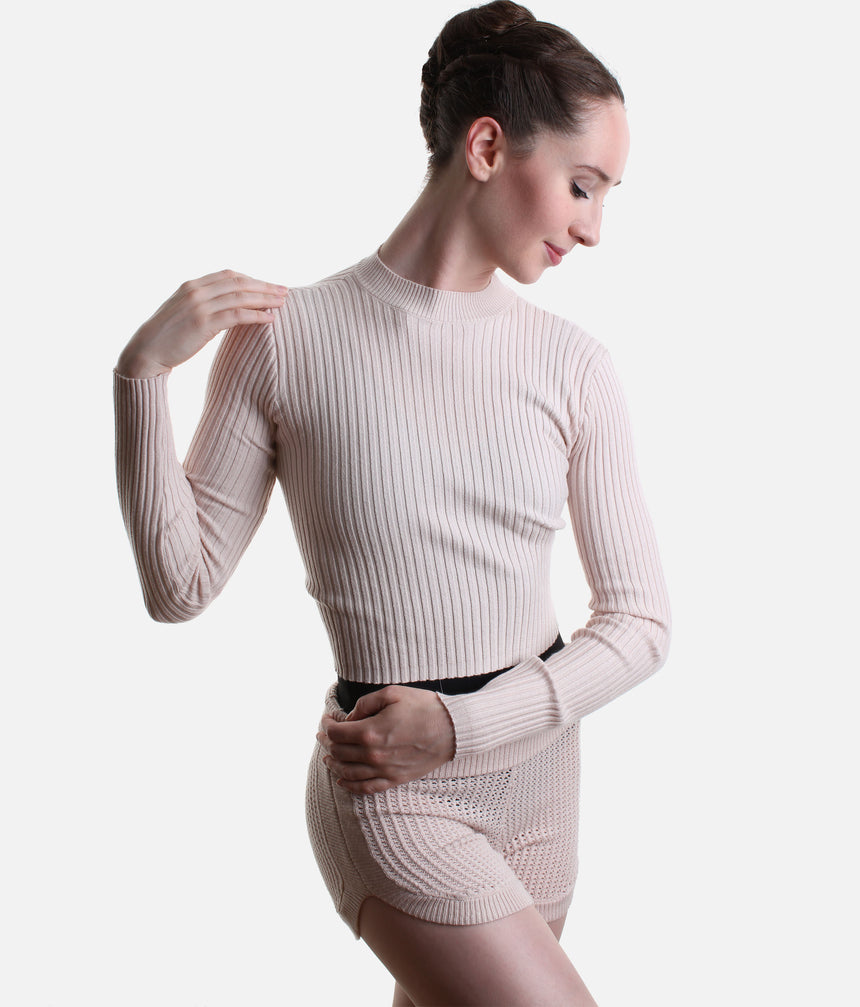 Front view of Pink Capezio Mise-En-Scene Coppola top showing its ribbed body and long sleeves, paired with Pink Anderson shorts.