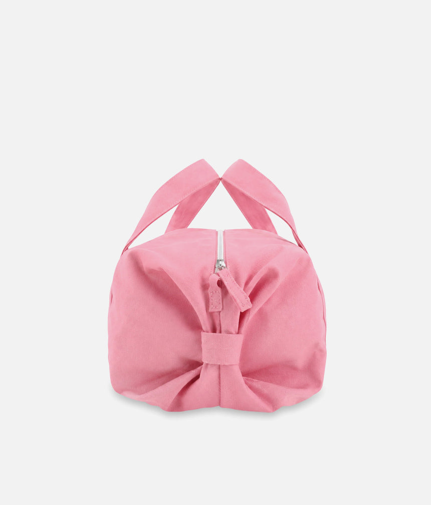 End view of the Repetto B0390T pink ballet bag showing its rounded shape, gathered bow detail and zip pull.