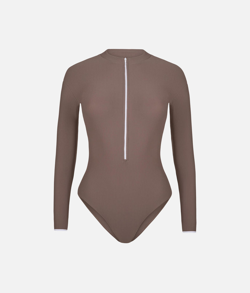 Front of Mara Dancewear Aura Long Sleeve Deep Brown leotard, with ribbed fabric, high neck and contrasting white zip.