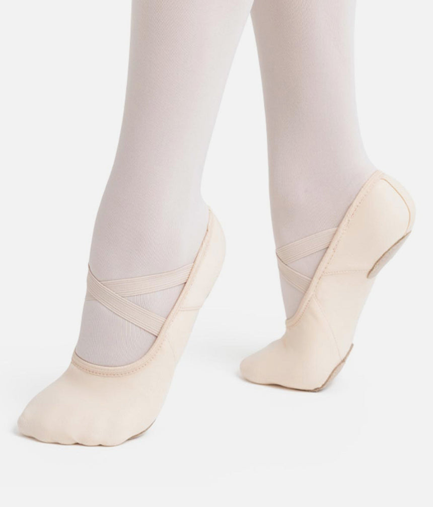 Capezio Hanami Canvas Split-Sole Ballet Shoe - stretch canvas displayed in a releve position.