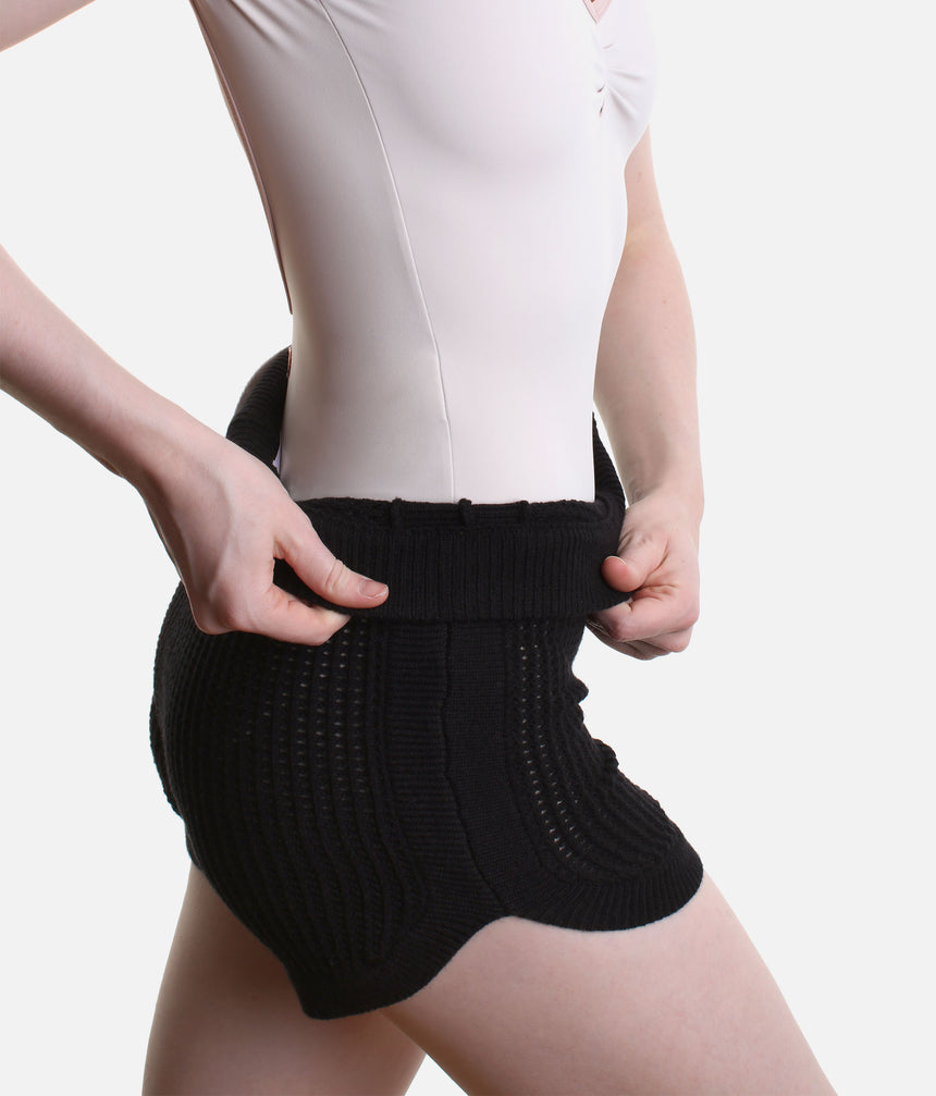 Capezio Anderson CK11014W warm-up shorts in Black, showing the short leg, ribbed waist and open knit over a pale leotard.