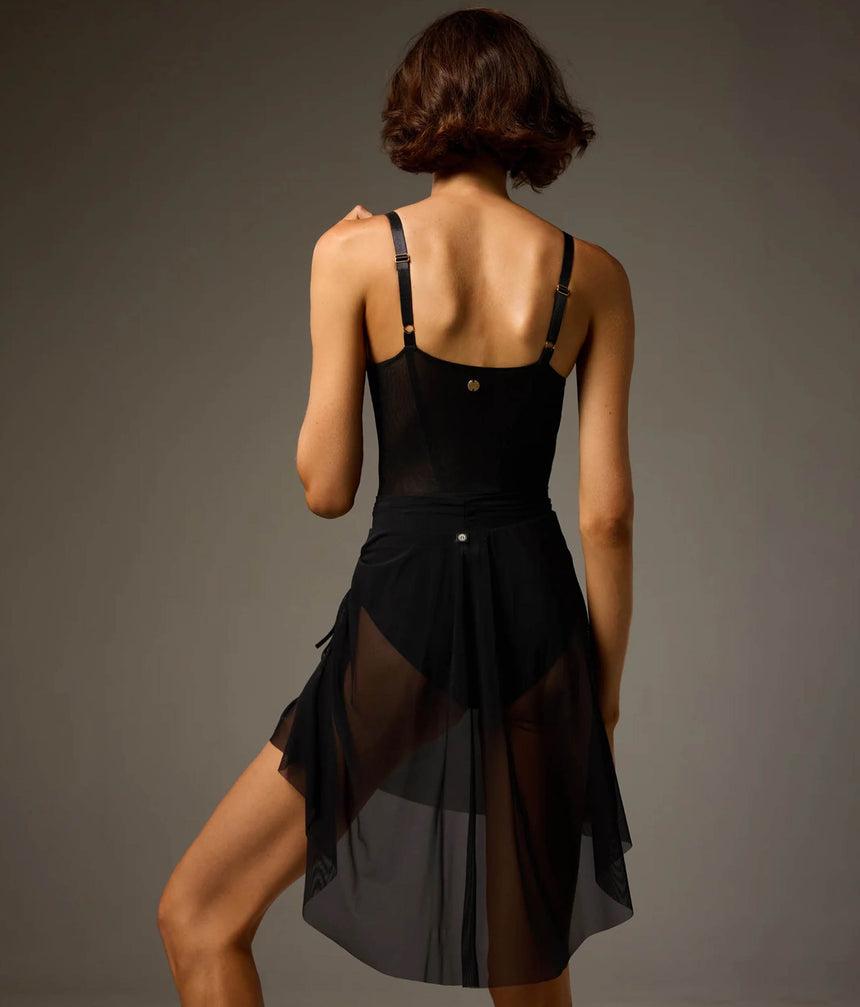Back view of the black Bodile Gisella mesh rehearsal skirt, showing sheer fabric and gathered side detailing.