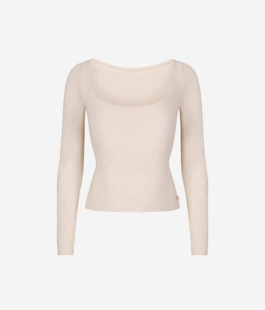 Mara Dancewear Light Cream reversible knit ballet top, showing the scoop-neck side, long sleeves and cropped hem.