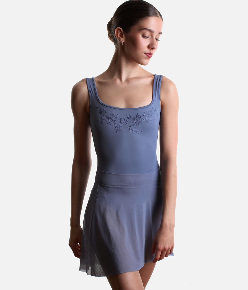 Front view of the Mirella Adagio mesh skirt in Dusty Grey, falling over the upper thighs beneath a coordinating tank leotard.