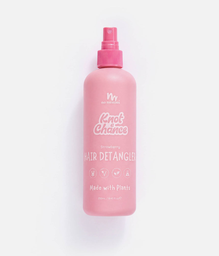 A pink spray bottle of Knot Chance Strawberry Hair Detangler on a clean white background.
