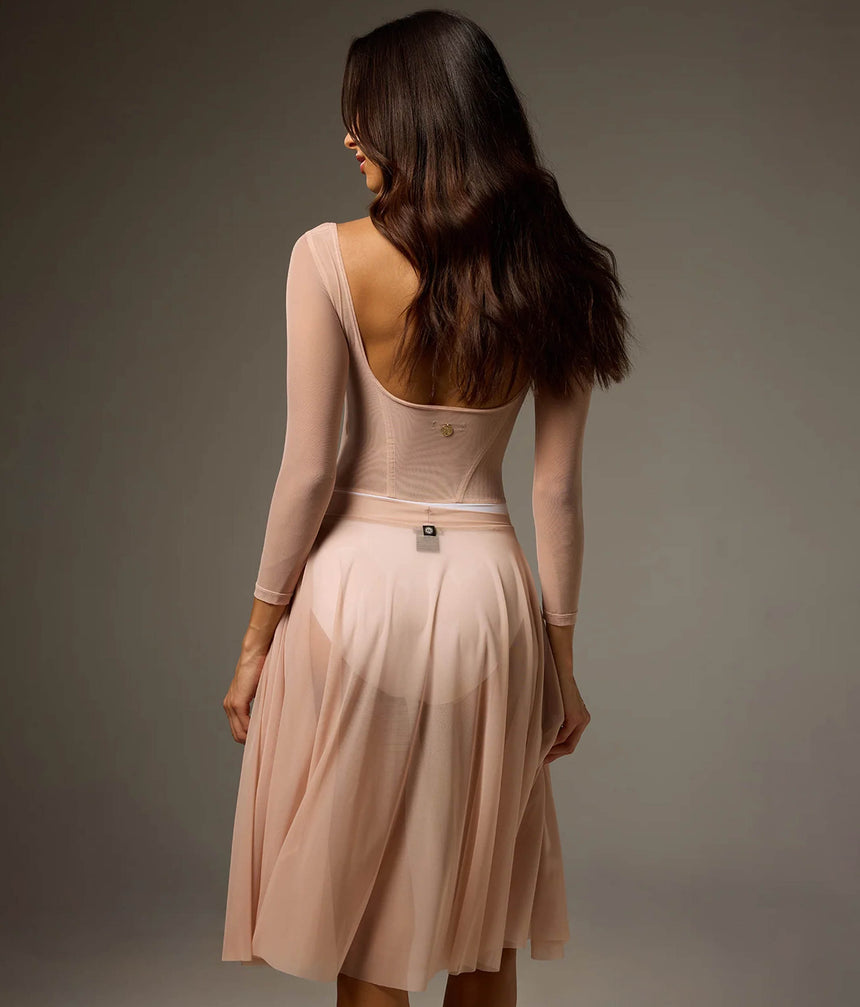 Back of Bodile Sofia Frost Nougat leotard with a deep scoop neckline, worn with a separate flowing blush Julieta mesh skirt.