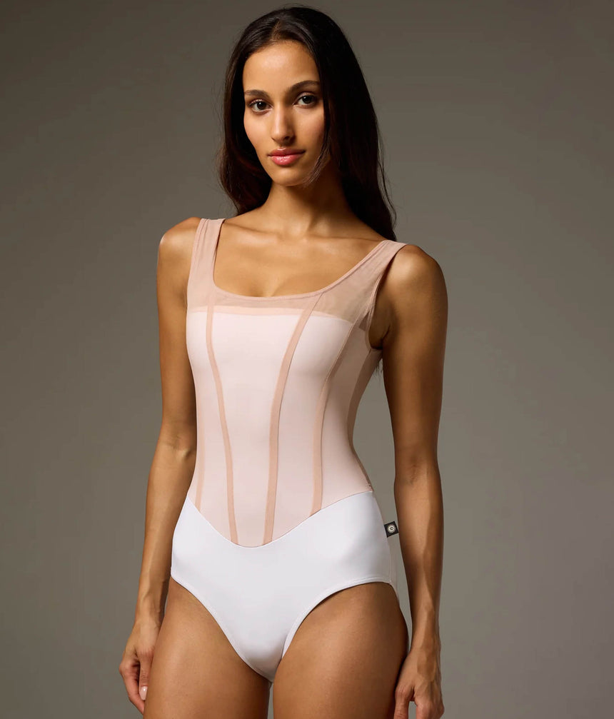 Front of Bodile Sofia Nougat Frost tank ballet leotard with a white body, pale blush mesh overlay and corset-style seams.