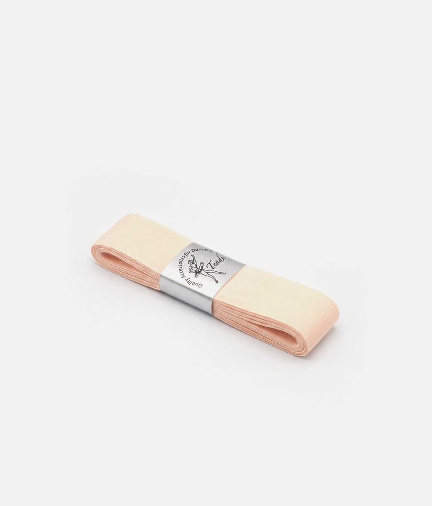 Folded pale pink Tendu pointe shoe ribbon with a silver branded band, displayed flat on a white background.