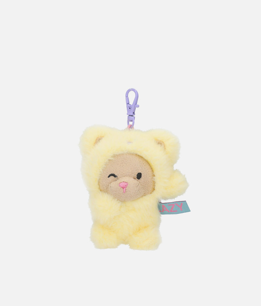 PENfection Tiny Crew Lazy dog bag charm wearing a yellow bear jumpsuit with a purple clip