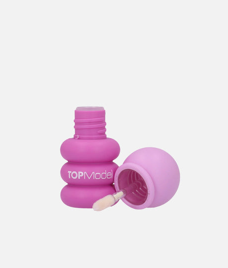 Open bright pink TOPModel Bubble KPOP strawberry lip gloss bottle with lilac cap and soft-tipped wand