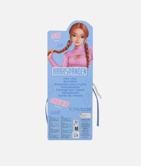 A retail package for TOPModel brand hair clips, featuring a blue cardboard backing with a cartoon illustration of a girl with braided hair wearing pink hair clips, plus a small pair of light blue hair clips visible at the sides.