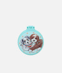 Closed turquoise Miss Melody folding hairbrush with two puppies, a striped bandana and aqua rhinestone details