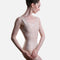 Front view of Pink Capezio Cristóbal F12702W leotard with broad tank straps and long bodice seams leading into a V-shaped waistline.