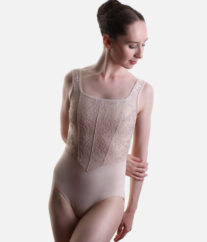 Three-quarter front view of Pink Capezio Cristóbal tank leotard showing the floral bodice, shaped front panels and smooth lower section.