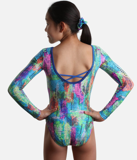 Back of Mondor Hieroglyph 17895 gymnastics leotard showing a deep blue-trimmed scoop, two crossed straps, colourful print and matching scrunchie.
