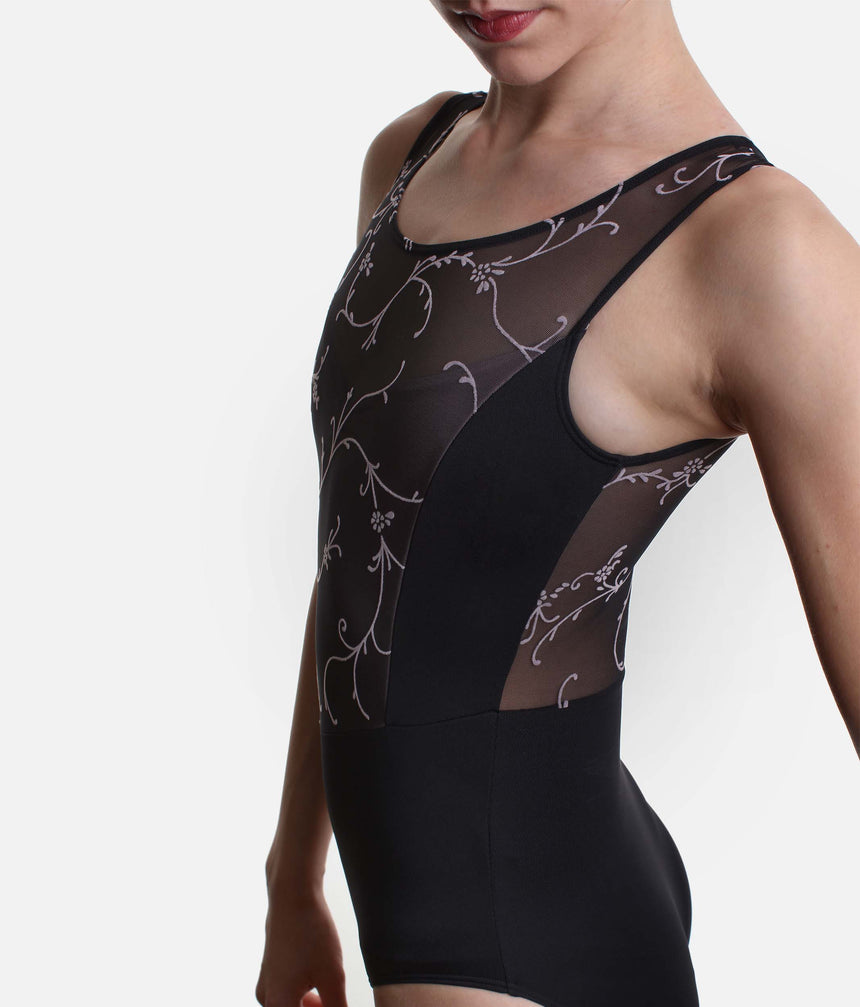 Close-up of Iggy’s solid black side panel between the floral tulle front and sheer back.