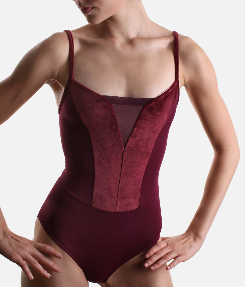 Close-up of India’s curved burgundy velvet bodice panels, V-shaped tulle neckline inset and fine camisole straps.