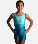 Mondor 7811 Mallard girls’ gymnastics biketard with sweeping aqua and teal panels, a round neckline and short legs.