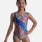 Mondor Futura 7888 girls’ tank gymnastics leotard with a colourful circle print, sweeping blue diagonal panel and round neckline.