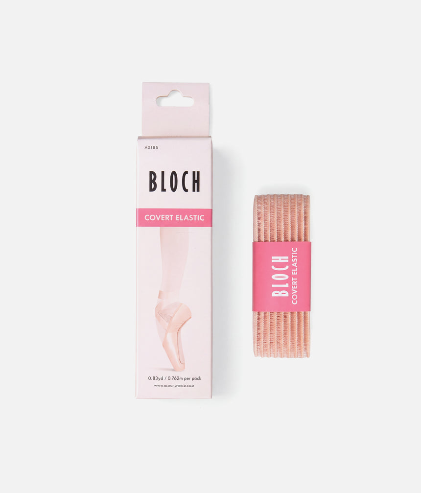 Bloch Covert Elastic packaging box next to a rolled pink elastic band with a pink Bloch Covert Elastic label, on a light gray background.