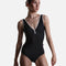 Back view of YUMIKO Alicia Black ballet leotard showing the deep V-back outlined in Misty Rose crushed velvet.