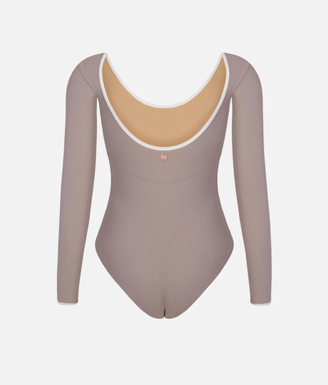 Mara Dancewear Alma Soft Brown worn from behind, showing the low scoop back, pale edging and small metallic emblem.