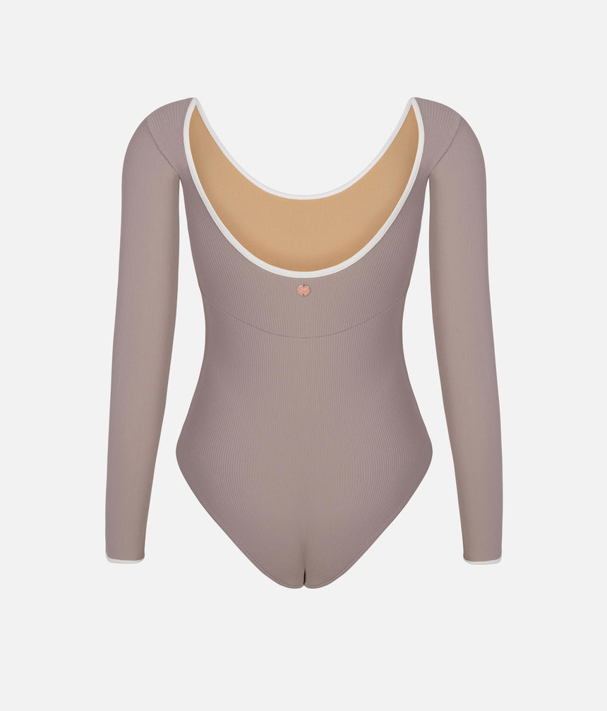 Mara Dancewear Alma Soft Brown worn from behind, showing the low scoop back, pale edging and small metallic emblem.