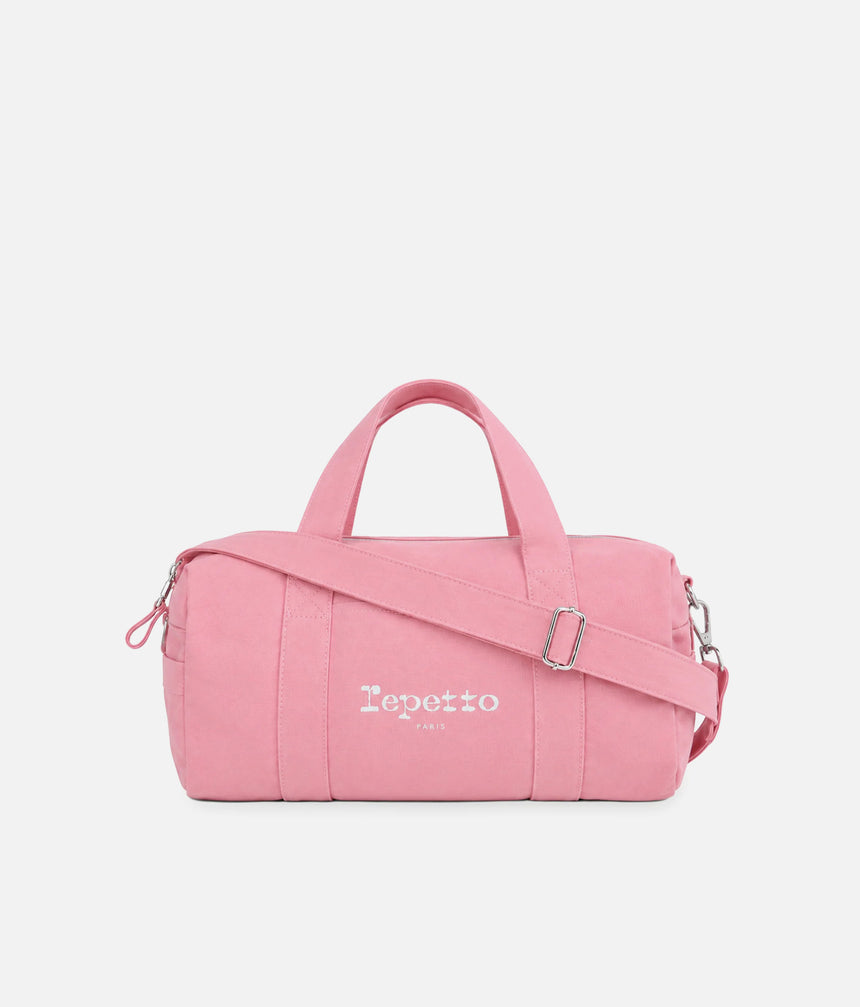 Repetto B0390T pink medium duffle bag with white Paris logo, twin handles and an adjustable shoulder strap across the front.