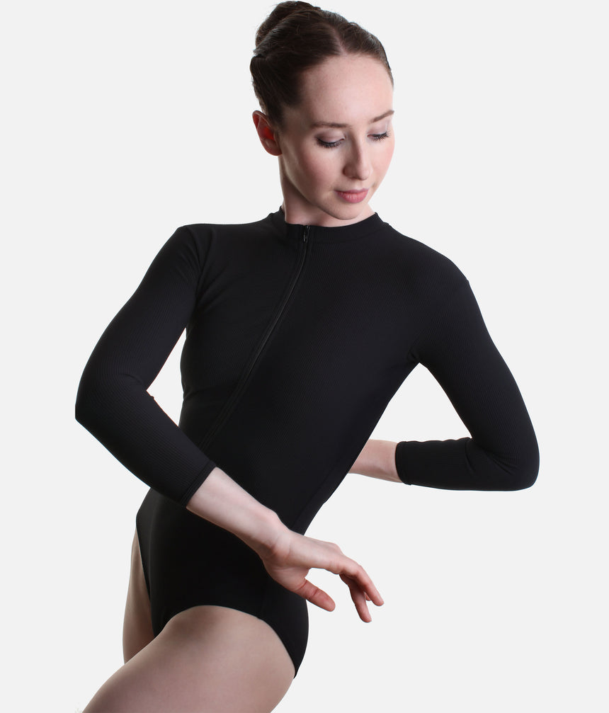Front worn view of Mara Dancewear Aura Long Sleeve in Total Black with a high neck, long sleeves and front zip.