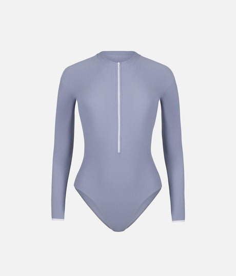 Front view of Mara Dancewear Aura Long Sleeve leotard in Soft Misty Blue with ribbed fabric, high neck and front zip.
