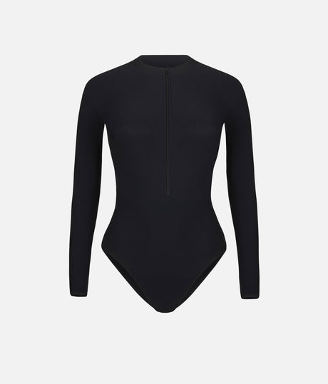 Front worn view of Mara Dancewear Aura Long Sleeve in Total Black with a high neck, long sleeves and front zip.