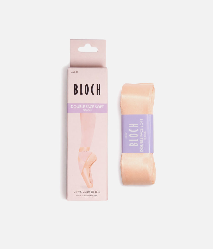 BLOCH A0531 Double Face Soft Ribbon packaging beside folded pink satin pointe shoe ribbon.