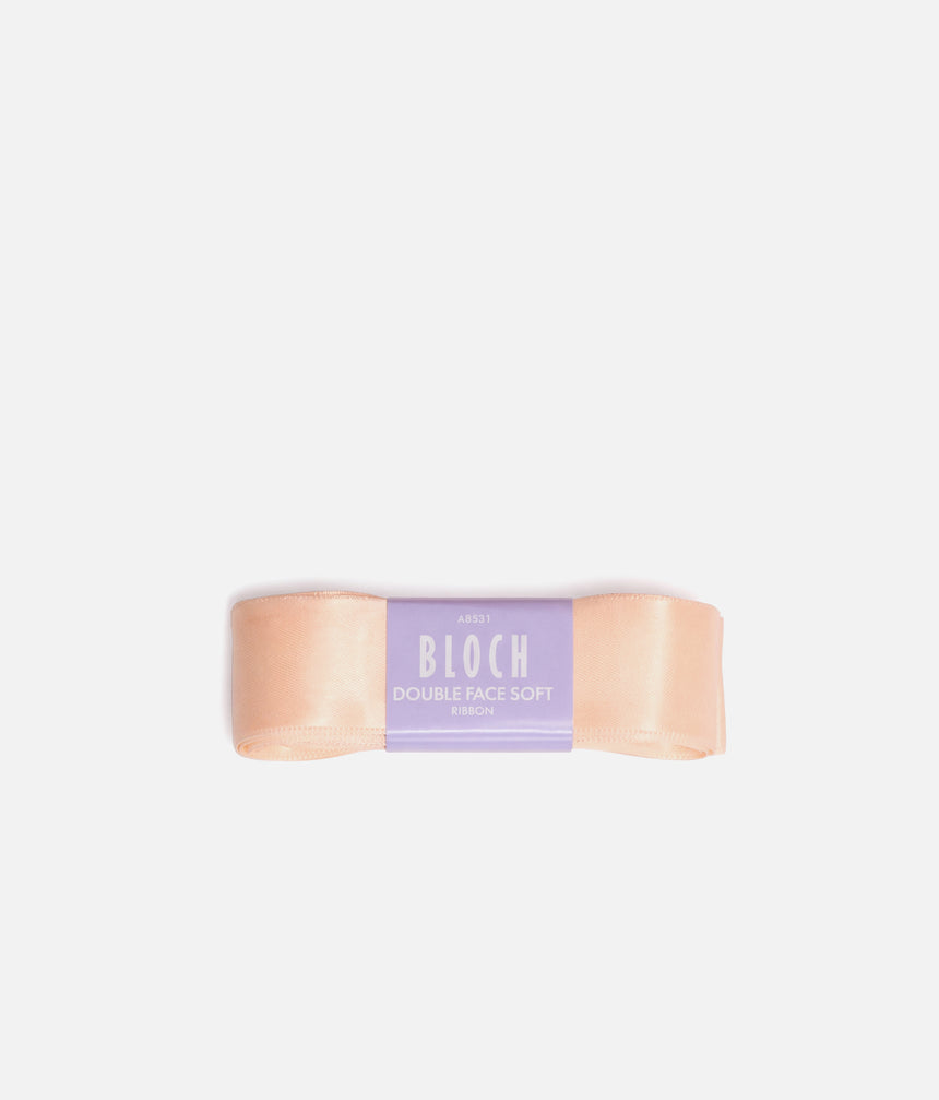 Folded pink BLOCH Double Face Soft satin pointe shoe ribbon with a lilac branded band.