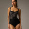 Front of Bodile Ophelia Leopard ballet leotard, showing the velvet bodice, pinched neckline, mesh trim and black body.