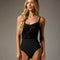 Bodile Ophelia Black Dahlia ballet leotard worn from the front, showing floral flocking, a pinched neckline and waist ribbon.