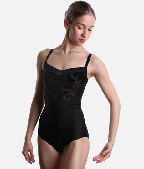 Bodile Ophelia Black Dahlia leotard on a model, showing the pinched floral velvet front, mesh neckline trim and waist ribbon.