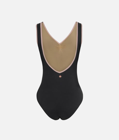 A black one-piece bodysuit with a large beige V-shaped back panel, trimmed with light pink piping and featuring a small metallic star detail at the center.