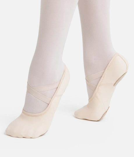 Capezio Hanami Canvas Split-Sole Ballet Shoe - stretch canvas displayed in a releve position. 