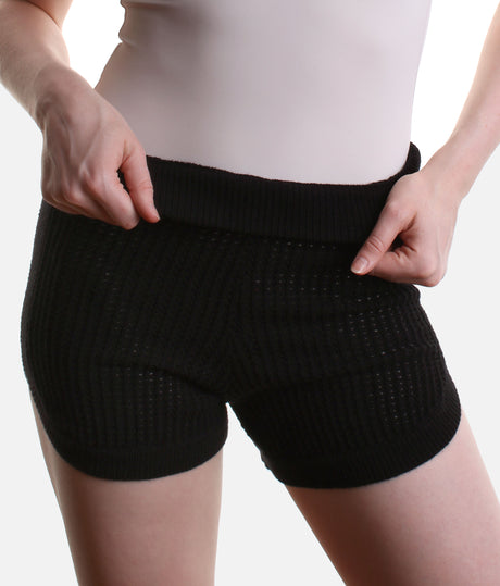 Capezio Anderson CK11014W warm-up shorts in Black, showing the short leg, ribbed waist and open knit over a pale leotard.