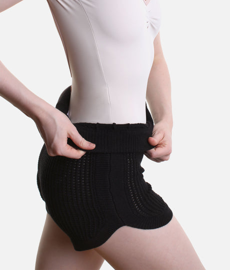 Capezio Anderson CK11014W warm-up shorts in Black, showing the short leg, ribbed waist and open knit over a pale leotard.