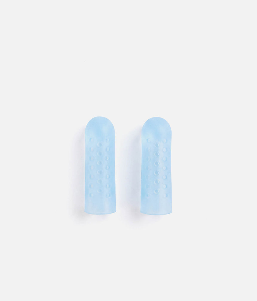 Two pale blue Tendu Cool Toe Caps standing side by side, showing their slim shape and perforated sides.