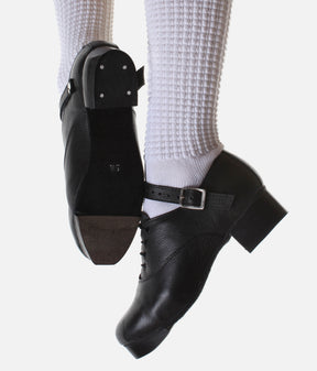 Antonio Pacelli Essential black Irish dancing jig shoes worn with white poodle socks, showing side and sole views