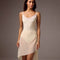 Front view of the Bodile Gisella mesh rehearsal skirt in ivory, showing side ruching and an asymmetric hem.