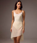 Front view of the Bodile Gisella mesh rehearsal skirt in ivory, showing side ruching and an asymmetric hem.