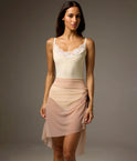Bodile Gisella mesh ballet skirt in blush beige, shown over a leotard with gathered detailing at the hip.