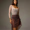Bodile Gisella rehearsal skirt in smoky plum, showing ribbon ruching and a sheer asymmetric hem.