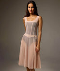 Front view of the Bodile Julieta mesh rehearsal skirt in blush beige, styled over a tank leotard.