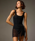 Dancer wearing a Ash Bodile Mika mesh ballet skirt with gathered ruching and a left-side split over a leotard.