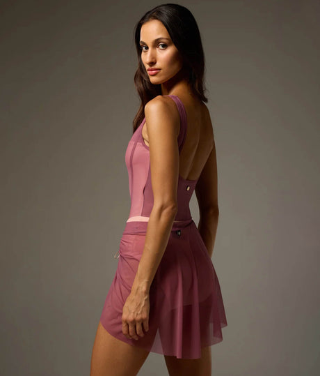 Dancer wearing a Rose Bodile Mika mesh ballet skirt with gathered ruching and a left-side split over a leotard.